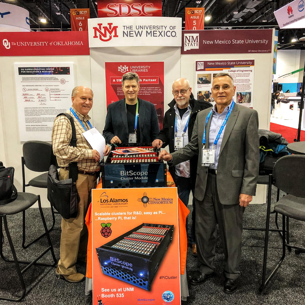 Gary, Bruce, Norman and Jim at the UNM Booth with the BitScope Cluster Module